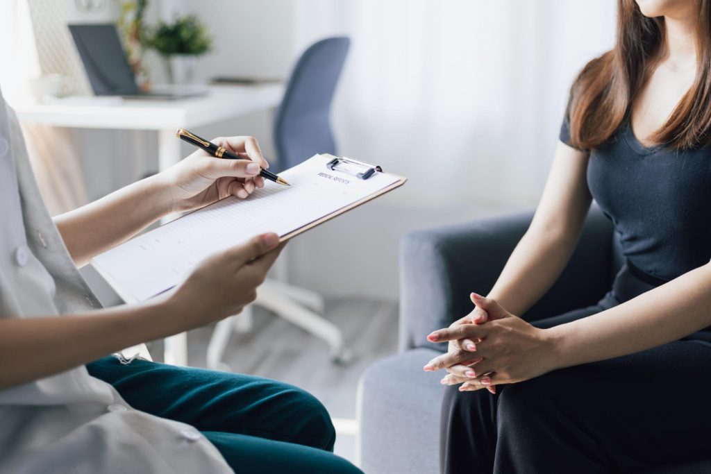 Woman visits a doctor in a hospital examination room